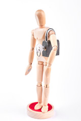 Wooden dummy with padlock on shoulder. Wooden mannequin holding on shoulder grey lock with key. Safety and security concept.