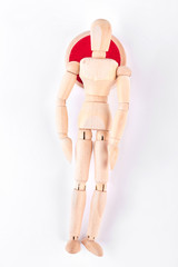 Lying wooden dummy, top view. Wooden mannequin lying on white background. Illness and disease concept.