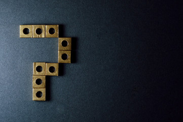 golden square nuts forming number seven