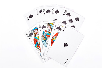 Spade royal flush playing cards. Spade royal flush in playing cards isolated on white. Spade royal flush cards on white.