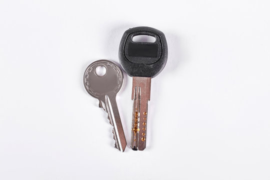 Two keys on white background. Photo of keys isolated on white background. Office keys over white.
