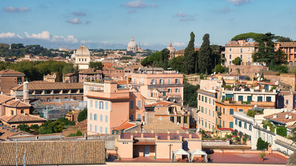 Fototapeta na wymiar Arranged roofs and domes of Rome city center, Italy