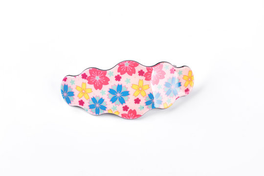 Hair clip with floral design. Woman cute hair pin isolated on white background. Woman hair accesory.
