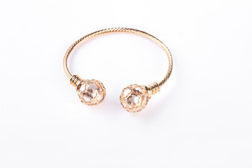 Gold bracelet on a white background. Female beautiful bracelet isolated on white background. Woman luxury jewelry.