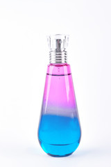 Pink and blue perfume bottle. Glass woman perfume bottle isolated on white background.