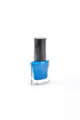 Blue nail polish on white background. Blue varnish for manicure or pedicure isolated on white background.