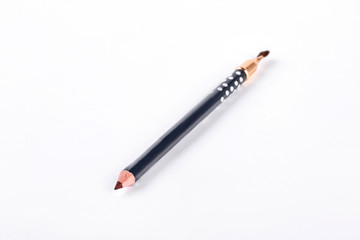 Eyebrow pencil on white background. Brown eyeliner pencil isolated on white background.