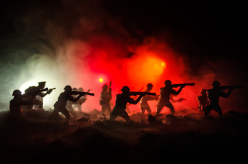 War Concept. Military silhouettes fighting scene on war fog sky background, World War Soldiers...