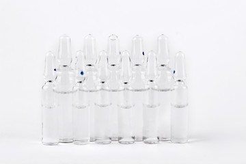 Raw of medical ampoules for injections. Set of break-seal glass ampules with medicine liquid.