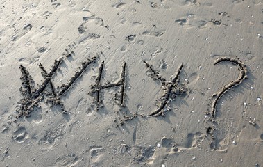 great inscription WHY on the beach sand