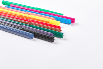 Set of multicolored markers. Collection of marker pens of different colors over white background. School and drawing concept.