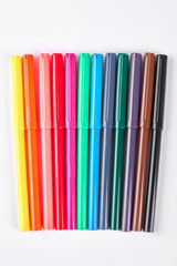 Fototapeta premium Colorful markers on white background. Rainbow collection of markers over white background.