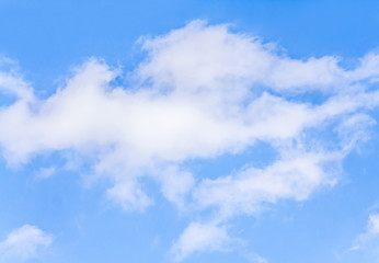 White clouds against blue sky as background for design
