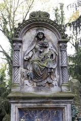 Fototapeta na wymiar Madonna with her Child on the old Prague Cemetery, Czech republic