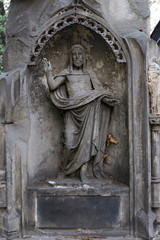 Fototapeta na wymiar Historic Jesus on the mystery old Prague Cemetery, Czech Republic
