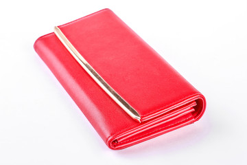 Female red wallet, white background. Red color bag isolated on white background. Female fashion accessory.