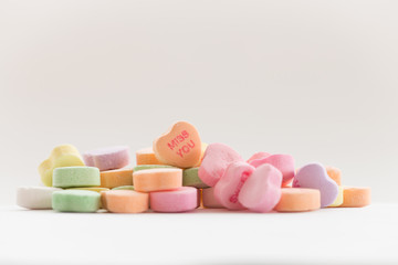 Valentine's day candy conversation hearts featuring the phrase Miss You