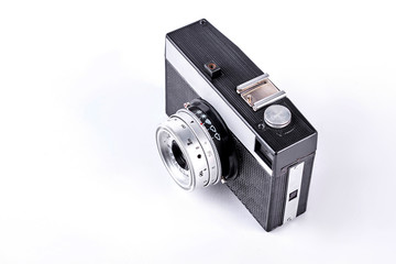 Old film camera, top view. Black and grey soviet photo camera isolated on white background.