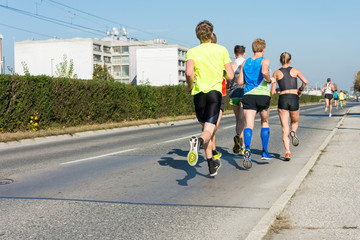 Fototapeta premium Marathong runners running a race.