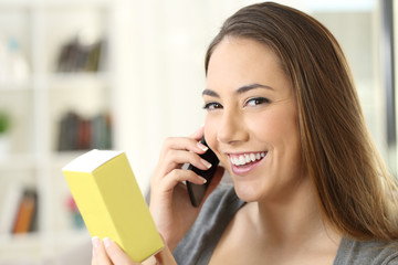 Girl calling on phone asking information about a product