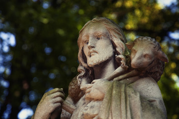 Ancient statue of Jesus Christ Good Shepherd