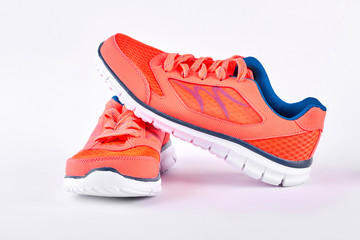 Pair of new modern sport shoes. Running shoes isolated on white background. Sport trainers for gym activity.