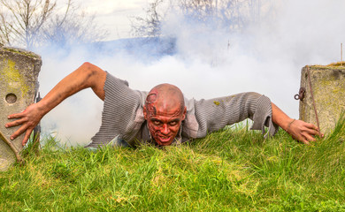 A living corpse climbing from the grave