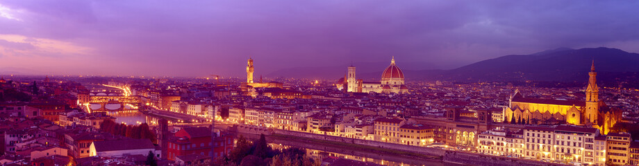 Panorama of famous Florence city and river Arno after sunset with night illumination, Tuscany, Italy, Europe. Travel outdoor sightseeing background.