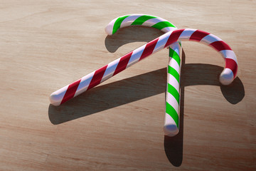 Candy Canes on Wooden Table Greeting Card Background Illustration