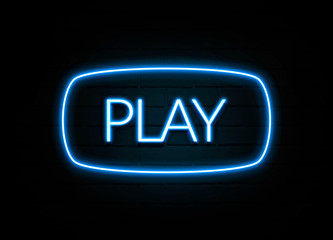 Play  - colorful Neon Sign on brickwall