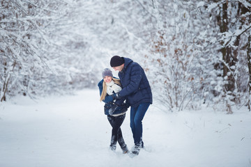 Happy Couple Having Fun Outdoors in Snow Park. Winter Vacation