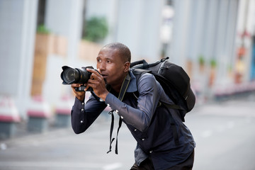 Young man photographing the surroundings of the city