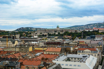 Cityscape of Budapest and Buda Castle (Royal Palace), Hungary. Old european town with dramatic clouds