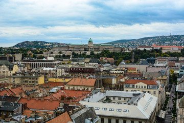 Fototapeta na wymiar Cityscape of Budapest and Buda Castle (Royal Palace), Hungary. Old european town with dramatic clouds
