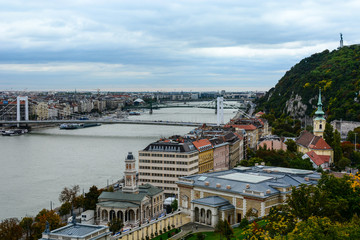 Cityscape of Budapest with Danube river, urban bridges and Liberty Statue on the Gellert Hill