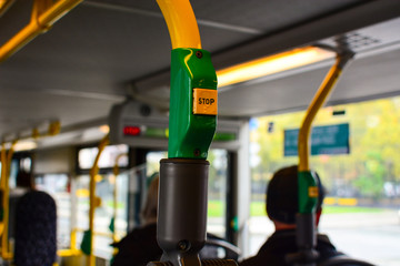 Stop button with Braille tactile writing system mark in public transport