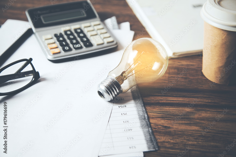 Poster idea or light bulb and calculator on document