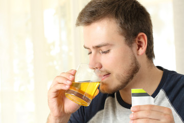 Man drinking a medicine