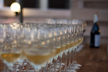 Glasses filled wine at the party table