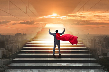 Businessman superhero successful in career ladder concept