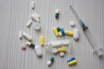 medical ampoule, bottle, pills and syringe
