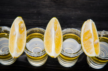 Tequila drink served in glasses with lime and salt