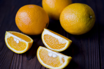 oranges and grapes on wooden background