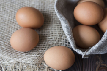 sack bag with eggs on the old table