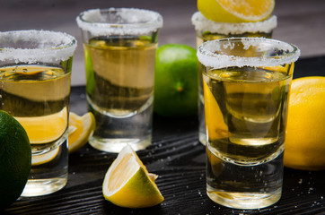 Tequila drink served in glasses with lime and salt