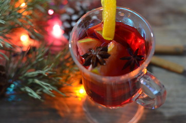 christmas hot mulled wine with cinnamon cardamom and anise on wooden background