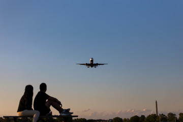 Couple Watching Airplanes Land