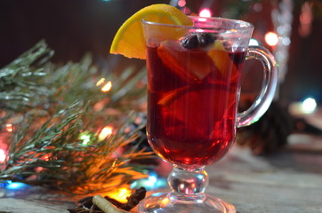 christmas hot mulled wine with cinnamon cardamom and anise on wooden background