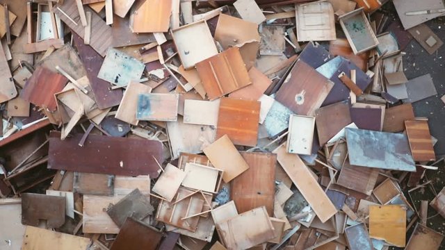 dump truck old broken wooden chairs throwing out vintage furniture one on the other thrown outside street bunch tables stools aged wardrobe garbage falling down antique cupboard boards junk waste