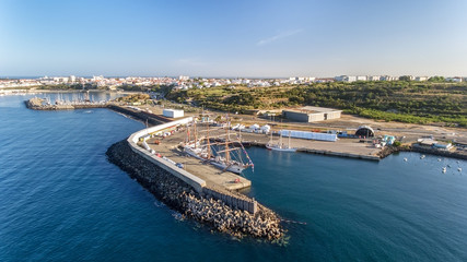 Aerial. Portuguese sea port Sinis with sailboats in regatta. Photographing from the drone.